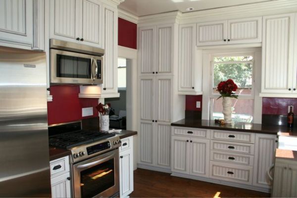 Red&#32;kitchen&#32;with&#32;white&#32;kitchen&#32;cabinets&#32;with&#32;beadboard&#32;doors