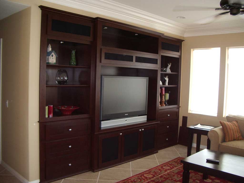 This&#32;maple&#32;wall&#32;unit&#32;has&#32;built&#32;in&#32;shelves&#32;and&#32;drawers.&#32;These&#32;wall&#32;unit&#32;is&#32;built&#32;into&#32;a&#32;wall&#32;niche.