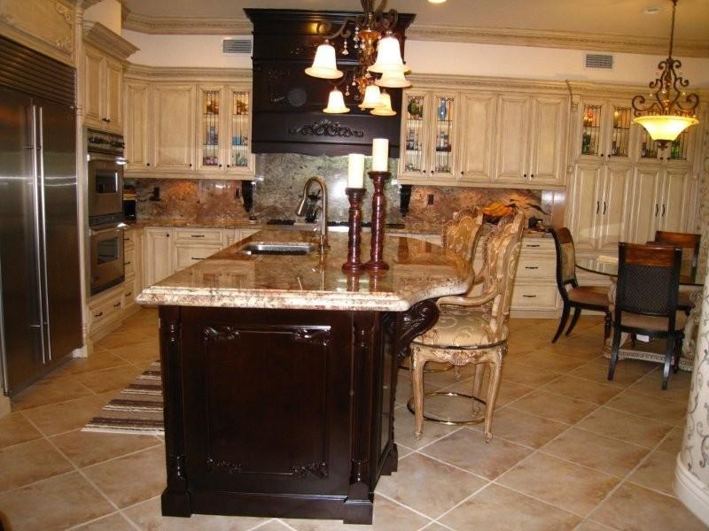 Antique&#32;white&#32;cabinets&#32;with&#32;dark&#32;kitchen&#32;island