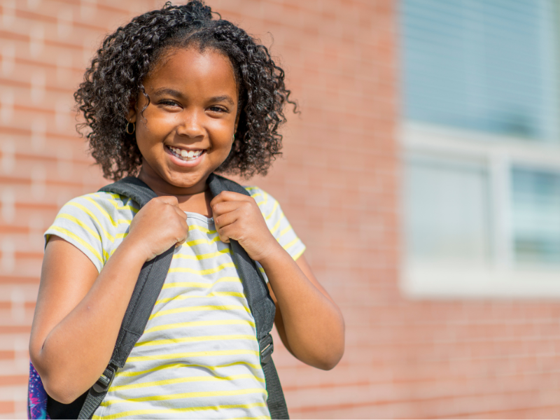 Young girl with backpack