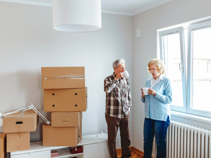 Seniors in home with moving boxes