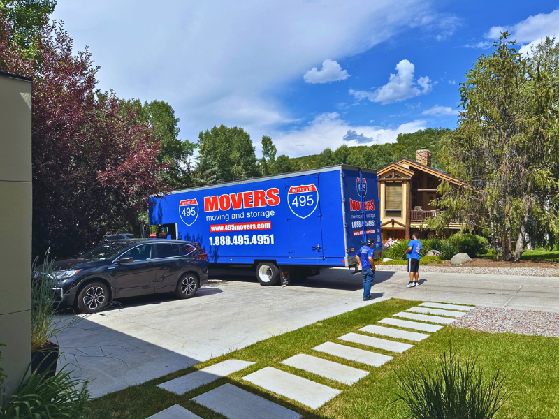 495 Movers truck parked in drive way in another state