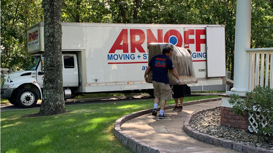 Movers moving couch