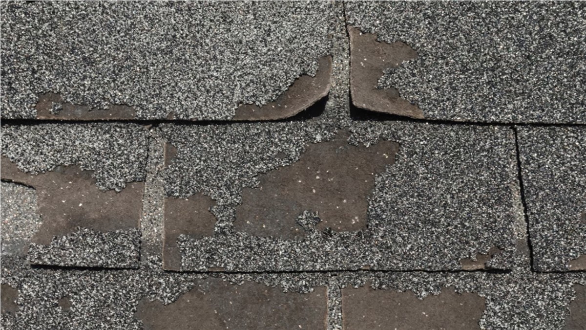 damaged-old-asphalt-roof-shingles