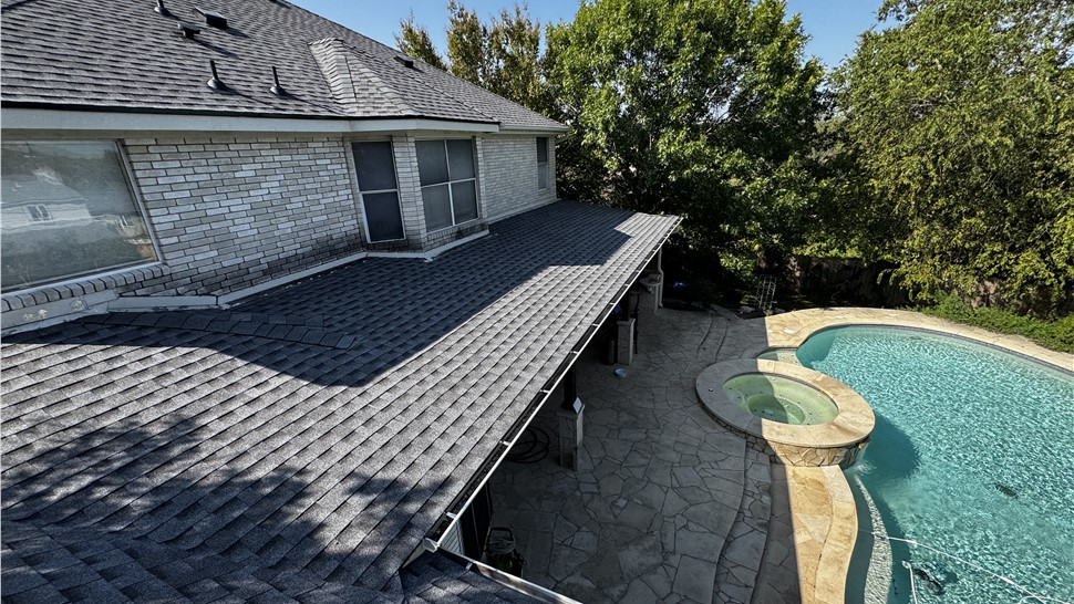 Finished low slope asphalt shingle roof over patio in Austin TX
