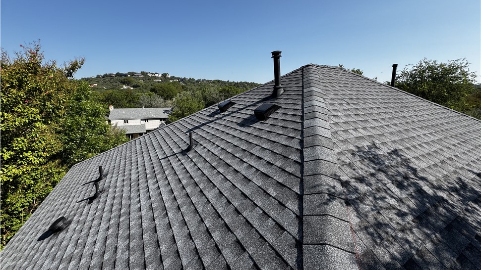 Roof ridge and ventilation on completed shingle roof in Austin TX