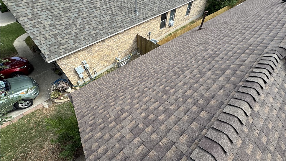 Finished roof with GAF Timberline HDZ Barkwood shingles in Austin TX