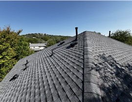 Roof ridge and ventilation on completed shingle roof in Austin TX