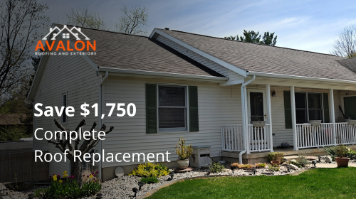 Grand Rapids home with a newly installed architectural shingle roof under clear Michigan skies