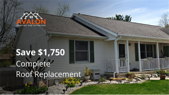Grand Rapids home with a newly installed architectural shingle roof under clear Michigan skies