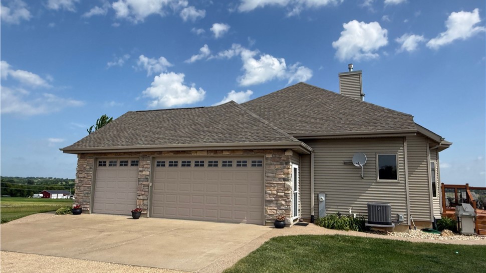 Newly installed asphalt shingle roof on a home in Freeport, IL.