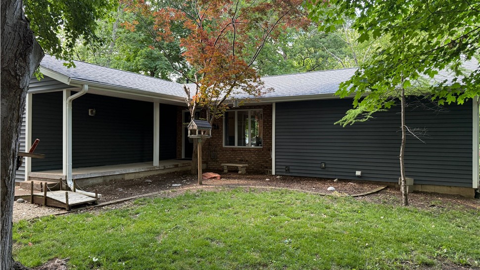 Storm-damaged home with newly installed GAF Timberline HDZ shingles.