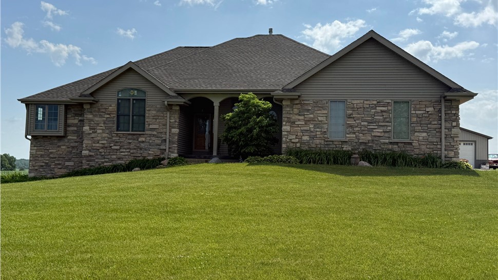 Completed roof replacement in Freeport, Illinois featuring GAF Timberline HDZ Weathered Wood shingles.