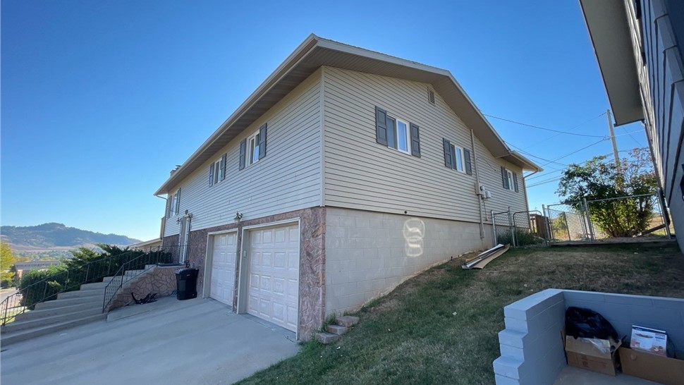 Spearfish SD home after James Hardie Iron Grey siding installation with black trim