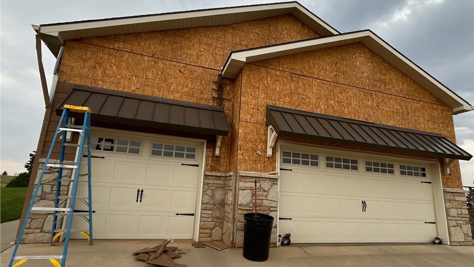 Completed exterior renovation in Rapid City, SD with Malarkey Highlander roof and James Hardie Aged Pewter siding.