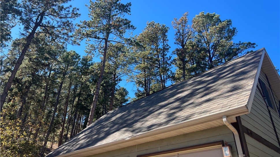Rapid City SD home before Malarkey Highlander roof and bronze gutter installation