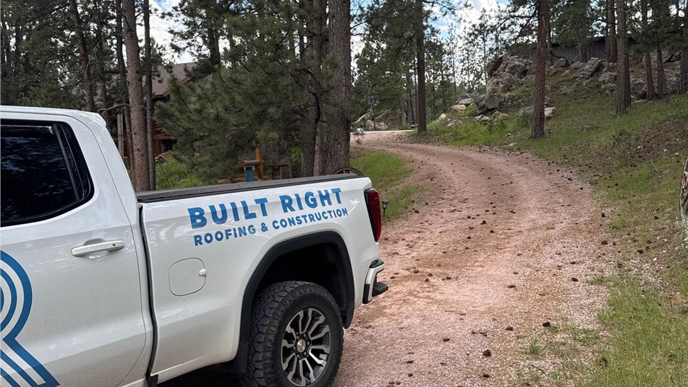 Completed roof replacement in Custer, SD featuring Malarkey Highlander Heather Blend shingles and brown trim.