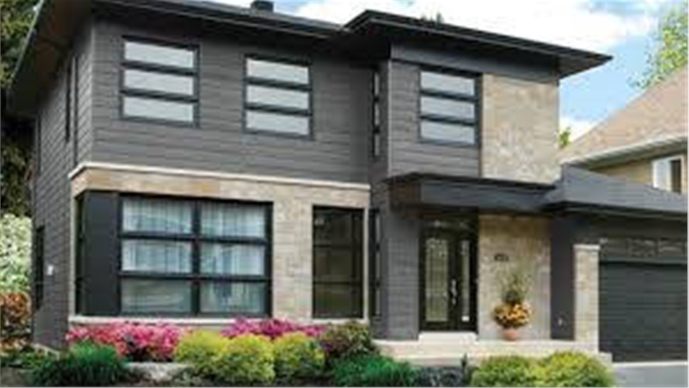 exterior of a house with stone and dark gray siding