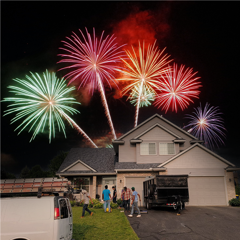 fireworks over suburban home