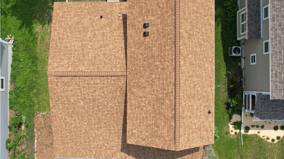 drone image directly above an orange tan roof