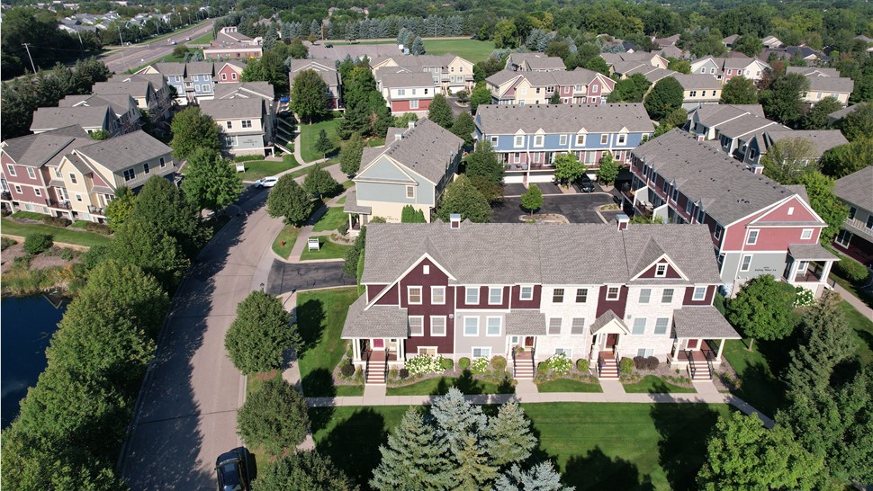 drone image of red and tan townhomes in woodbury, mn