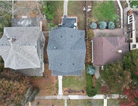 drone image of owens corning color of the year williamsburg gray installed on home