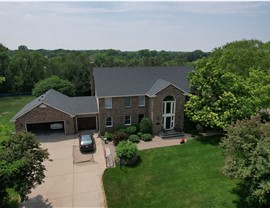 drone image of two story brick home