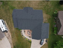 drone image of a home directly above the dark gray shingles