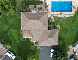 drone image of owens corning teak roof