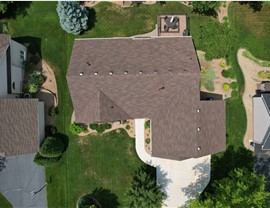 drone image directly over brown roof with rain diversion