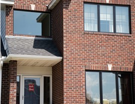 close up of black trim windows from Pella on brick home