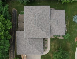 drone image of brown roof directly over home creating rectangle
