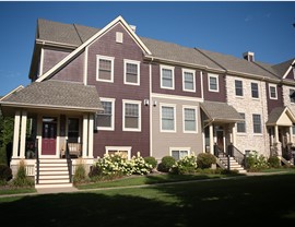 The windward condo association in woodbury, mn dark red maroon colored townhomes