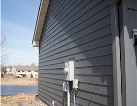The side of a home that has been resided with LP Smartside Lap siding