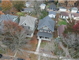 drone image of owens corning color of the year williamsburg gray installed on home