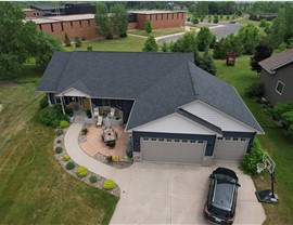 drone image of blue one story home
