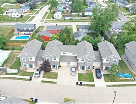drone shot of the front of one of a cedar pond townhome