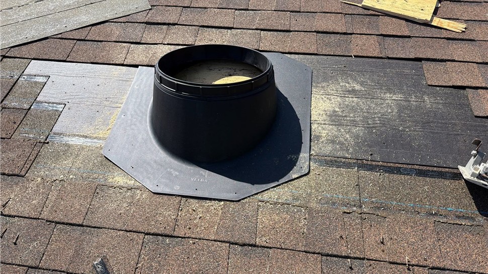 Solar tube flashing installation on residential roof in Anacortes Washington