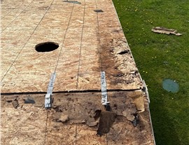 Damaged roof decking uncovered during roof replacement in Concrete WA