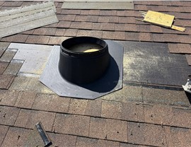 Solar tube flashing installation on residential roof in Anacortes Washington