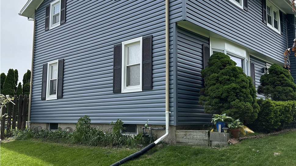 Siding Project in Liverpool, New York by C. Michael Exteriors, Inc.