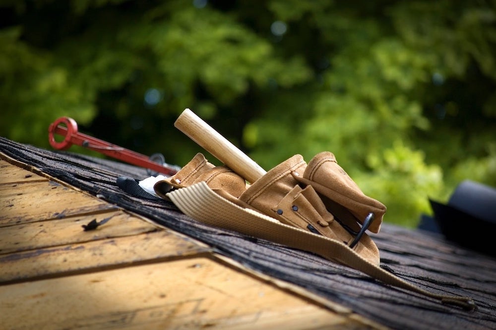 Closeup of a roofing toolbelt on a roof