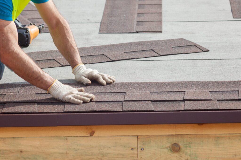 A Roofer Lays Shingles