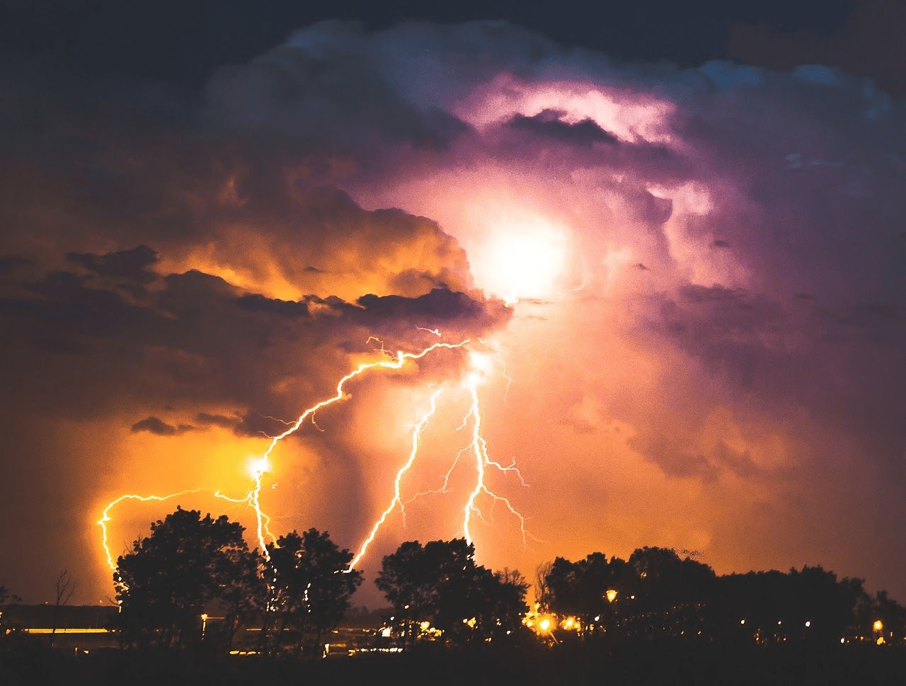 lightning strike over lake at night