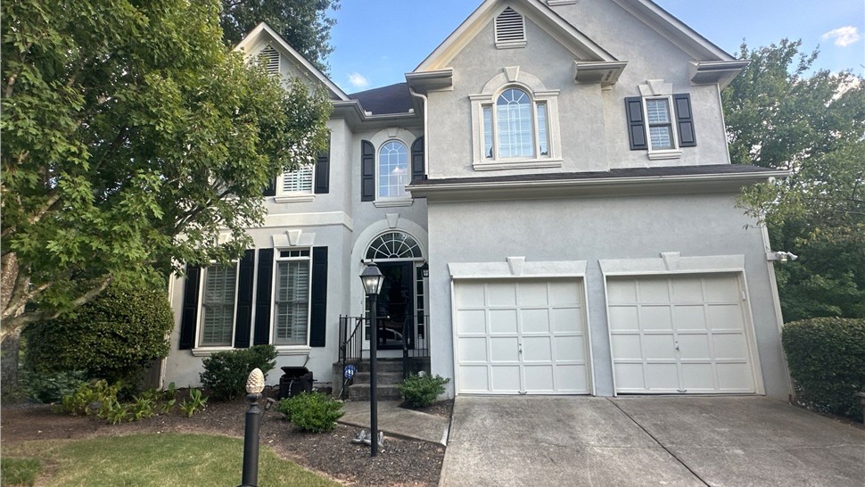 Storm damaged roof before replacement in Dunwoody, GA
