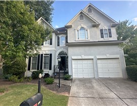 Storm damaged roof before replacement in Dunwoody, GA