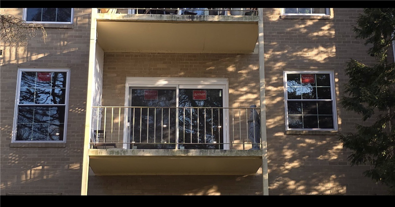 After window replacement in Haverford PA showing Sunrise Vanguard double-hung windows with grids and upgraded patio door installed by Earth Smart Remodeling for noise reduction and comfort improvement.