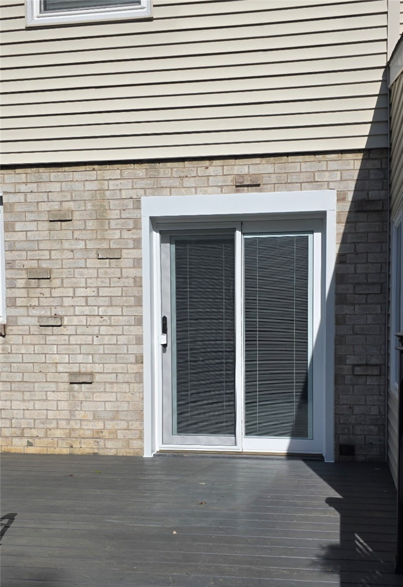 After door replacement in Southampton PA showing new sliding patio door with blinds between the glass installed by Earth Smart Remodeling