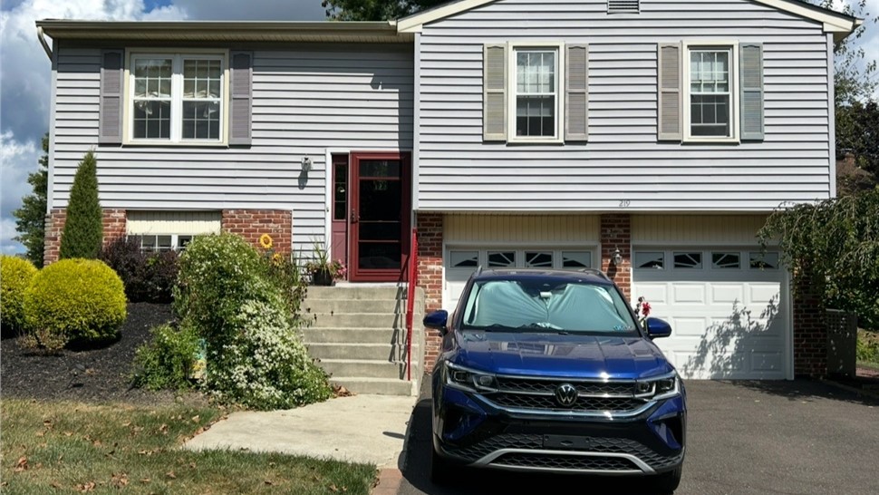 Before window replacement project in Newtown PA home exterior