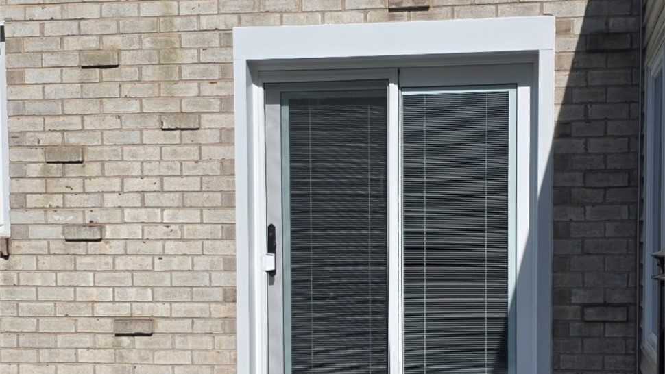 After door replacement in Southampton PA showing new sliding patio door with blinds between the glass installed by Earth Smart Remodeling